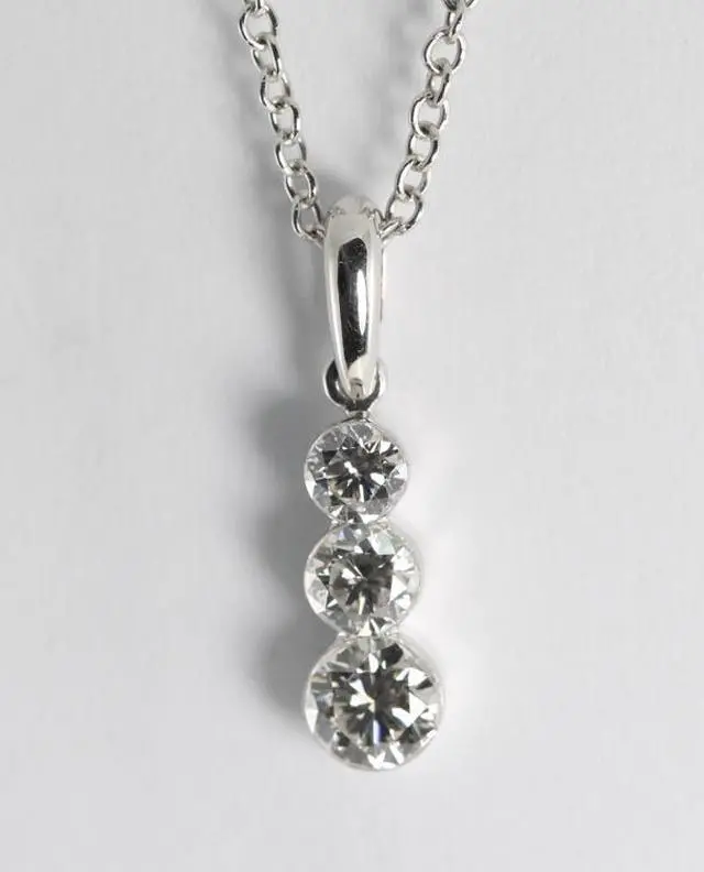 Main image of 18k White Gold Three Stone Round Cut Diamond Invisible Setting Pendant (0.52 Ct, G Color, VS Clarity)