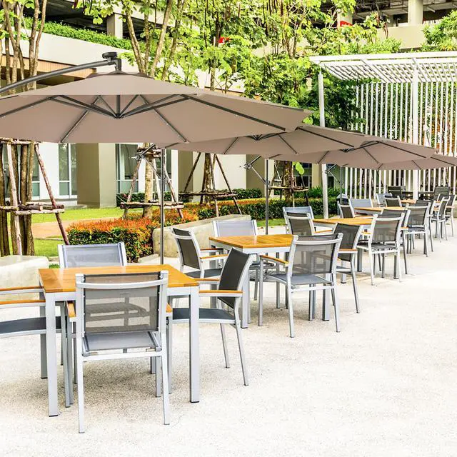Alt view image 2 of 7 - Costway 10' Hanging Solar LED Umbrella Patio Garden Sun Shade Offset Market W/Base Tan