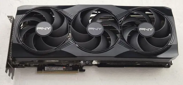 Main image of PNY GeForce RTX 5080 16GB GDDR7 PCIe 5.0 Triple Fan GPU Video Graphics Card VCG508016TFXPB1 with power adapter cable, nothing else. Video Graphics Card comes in plain non-retail package.