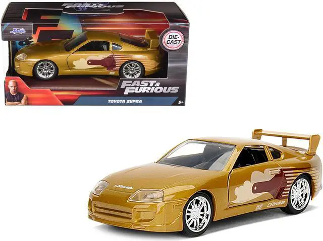 Alt view image 2 of 4 - Slap Jack's Toyota Supra Gold "Fast & Furious" Movie 1/32 Diecast Model Car by Jada