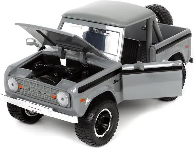 Alt view image 4 of 7 - 1973 Ford Bronco Pickup Truck Gray with Black Stripes with Extra Wheels "Just Trucks" Series 1/24 Diecast Model Car by Jada