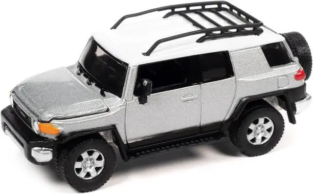 Alt view image 2 of 3 - 2007 Toyota FJ Cruiser Titanium Silver Metallic with White Top and Roofrack LTd Ed 1/64 Diecast Model Car by Johnny Lightning