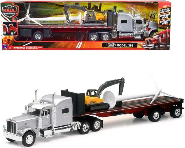 Main image of Peterbilt 389 Truck with Flatbed Trailer Silver Metallic with Excavator and Wind Turbine 1/32 Diecast Model by New Ray