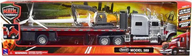 Alt view image 3 of 3 - Peterbilt 389 Truck with Flatbed Trailer Silver Metallic with Excavator and Wind Turbine 1/32 Diecast Model by New Ray
