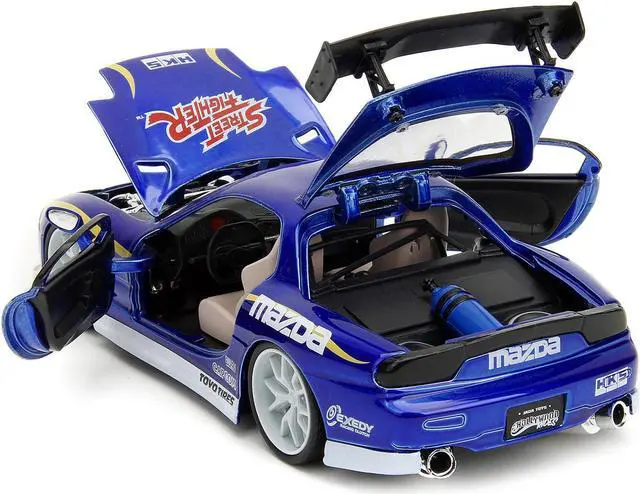 Alt view image 4 of 6 - 1993 Mazda RX-7 Candy Blue Met. w/Graphics and Chun-Li Diecast Figure "Street Fighter" Video Game 1/24 Diecast Model Car by Jada