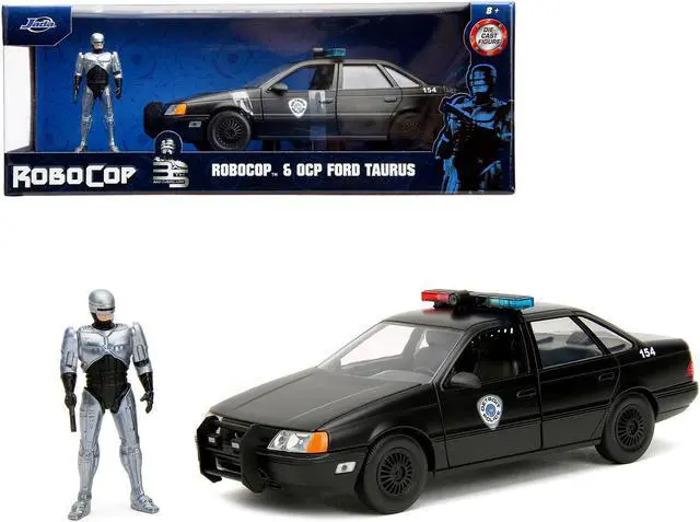 Main image of Ford Taurus OCP Matt Black "Detroit Police" and Robocop Figure "Robocop" (1987) Movie 1/24 Diecast Model Car by Jada