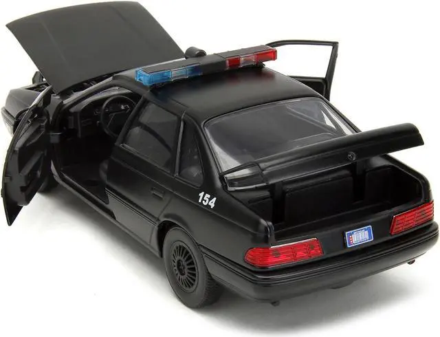 Alt view image 4 of 11 - Ford Taurus OCP Matt Black "Detroit Police" and Robocop Figure "Robocop" (1987) Movie 1/24 Diecast Model Car by Jada