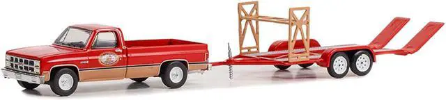 Alt view image 2 of 3 - 1982 GMC K-2500 Sierra Grande Wideside Pickup Truck Red and Beige with Black Stripes 1/64 Diecast Model Car by Greenlight