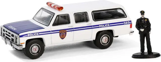 Alt view image 2 of 3 - 1985 GMC Suburban 2500 "NYC Transit Police Department" White with Blue Stripes and Figure 1/64 Diecast Model Car by Greenlight