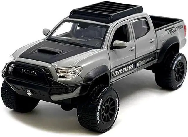 Alt view image 2 of 7 - 2023 Toyota Tacoma TRD PRO Off Road Truck Cement Gray with Black Hood and Roofrack 1/27 Diecast Model Car by Maisto