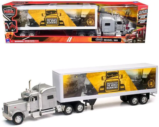 Alt view image 6 of 6 - Peterbilt 389 Truck Silver Metallic with Dry Van Trailer "Trucker Keep The World Running" 1/32 Diecast Model by New Ray