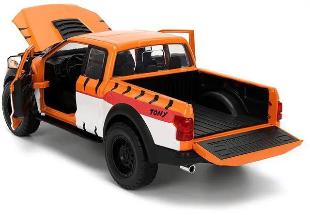 Alt view image 4 of 6 - 2017 Ford F-150 Raptor Pickup Truck "Frosted Flakes" Orange with Graphics and Figure 1/24 Diecast Car Model by Jada