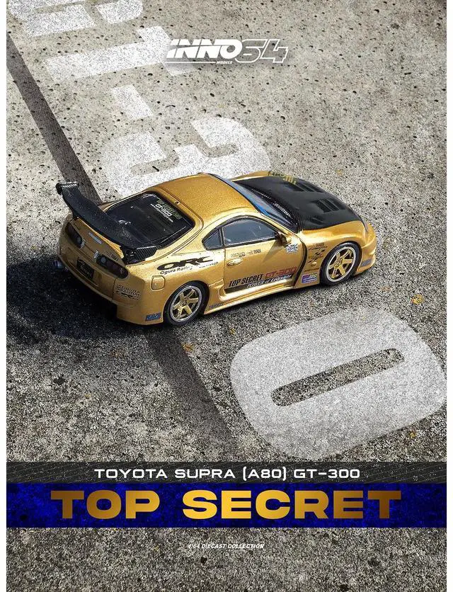 Alt view image 5 of 6 - Toyota Supra (A80) "Top Secret" GT300 RHD Gold Metallic with Carbon Hood 1/64 Diecast Model Car by Inno Models
