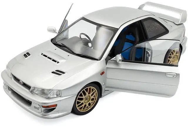 Alt view image 2 of 6 - 1998 Subaru Impreza 22B RHD (Right Hand Drive) Silver Metallic with Gold Wheels 1/18 Diecast Model Car by Solido