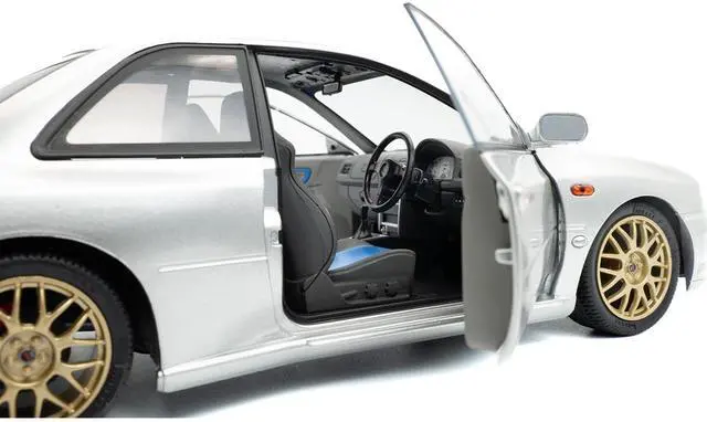 Alt view image 3 of 6 - 1998 Subaru Impreza 22B RHD (Right Hand Drive) Silver Metallic with Gold Wheels 1/18 Diecast Model Car by Solido