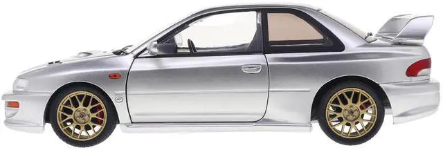 Alt view image 4 of 6 - 1998 Subaru Impreza 22B RHD (Right Hand Drive) Silver Metallic with Gold Wheels 1/18 Diecast Model Car by Solido