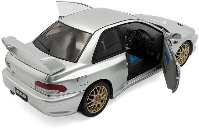 Alt view image 5 of 6 - 1998 Subaru Impreza 22B RHD (Right Hand Drive) Silver Metallic with Gold Wheels 1/18 Diecast Model Car by Solido