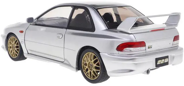 Alt view image 6 of 6 - 1998 Subaru Impreza 22B RHD (Right Hand Drive) Silver Metallic with Gold Wheels 1/18 Diecast Model Car by Solido