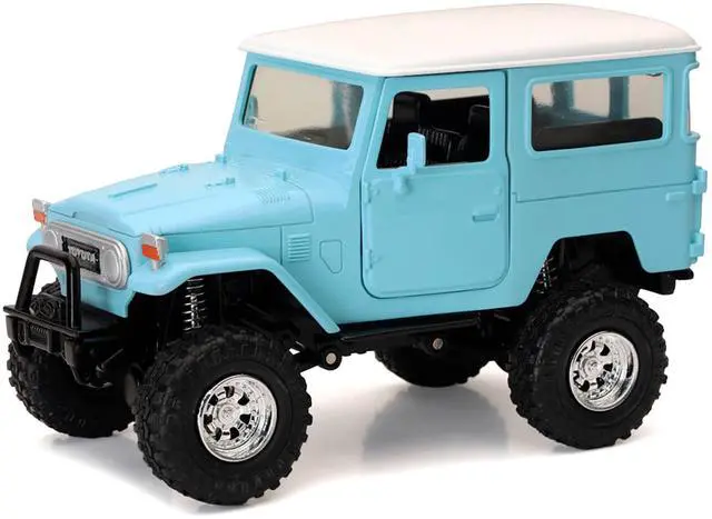 Alt view image 2 of 3 - Toyota Land Cruiser FJ40 Light Blue with White Top "Xtreme Off-Road" Series 1/24 Diecast Model by New Ray