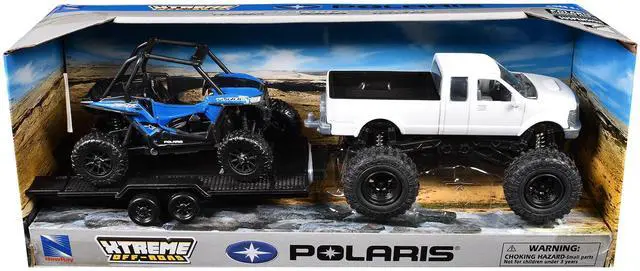 Alt view image 4 of 5 - Lifted Pickup Truck White and Polaris RZR XP Turbo Blue with Flatbed Trailer "Xtreme Off-Road" Series Diecast Model by New Ray