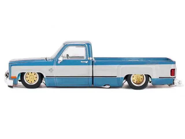 Alt view image 3 of 6 - Chevrolet Silverado Dually Truck "Vintage Spec V1" Light Blue Met w/White Sides and Interior 1/64 Diecast Model Car by Mini GT