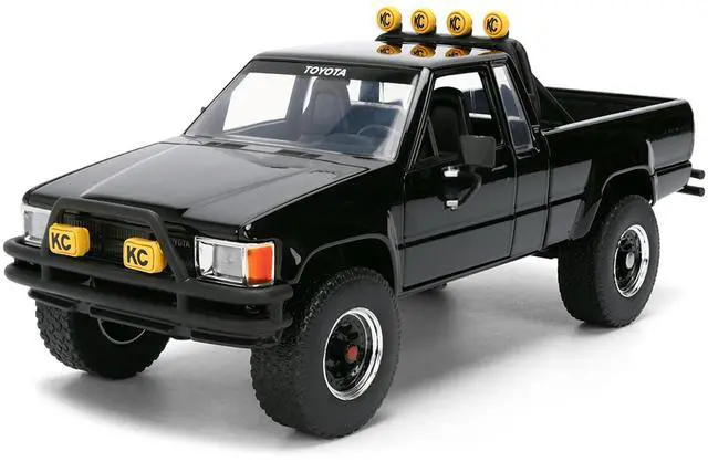 Alt view image 2 of 7 - 1985 Toyota SR5 Pickup Truck Black with Marty's Skateboard "Back to the Future" (1985) Movie 1/24 Diecast Model Car by Jada