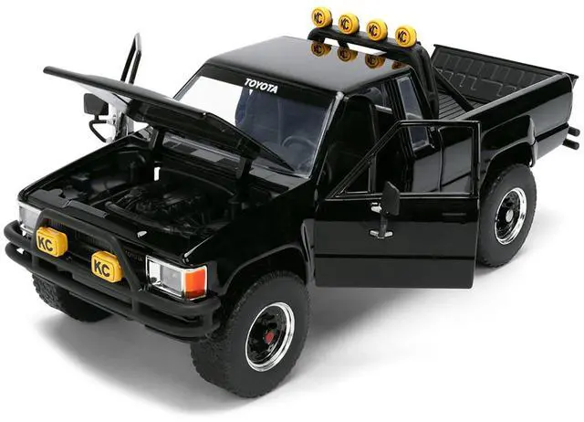 Alt view image 3 of 7 - 1985 Toyota SR5 Pickup Truck Black with Marty's Skateboard "Back to the Future" (1985) Movie 1/24 Diecast Model Car by Jada