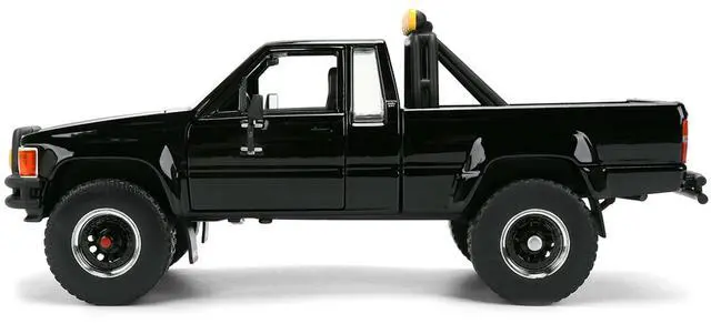 Alt view image 4 of 7 - 1985 Toyota SR5 Pickup Truck Black with Marty's Skateboard "Back to the Future" (1985) Movie 1/24 Diecast Model Car by Jada