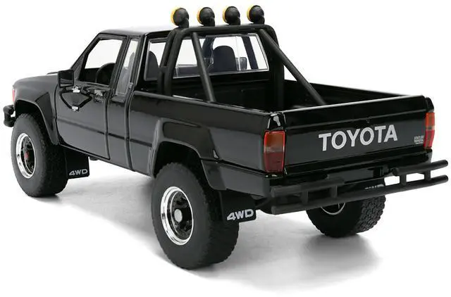 Alt view image 6 of 7 - 1985 Toyota SR5 Pickup Truck Black with Marty's Skateboard "Back to the Future" (1985) Movie 1/24 Diecast Model Car by Jada