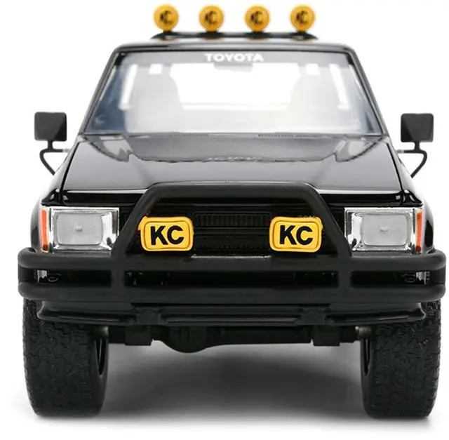Alt view image 7 of 7 - 1985 Toyota SR5 Pickup Truck Black with Marty's Skateboard "Back to the Future" (1985) Movie 1/24 Diecast Model Car by Jada