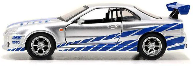 Alt view image 2 of 5 - Brian's Nissan Skyline GT-R (R34) RHD Silver Metallic with Blue "Fast & Furious 25th Anniversary" 1/32 Diecast Car Model by Jada