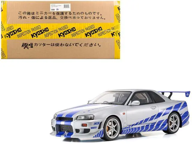 Main image of Nissan Skyline GT-R (R34) RHD Silver Metallic with Blue Graphics "2 Fast 2 Furious" (2003) Movie 1/12 Model Car by Kyosho