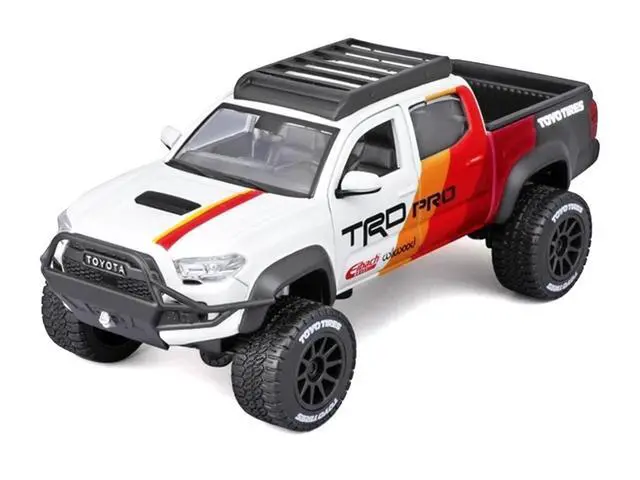 Main image of 2023 Toyota Tacoma TRD PRO Off Road Truck White with Graphics and Roof Rack "Maisto Design" Series 1/27 Diecast Model Car Maisto