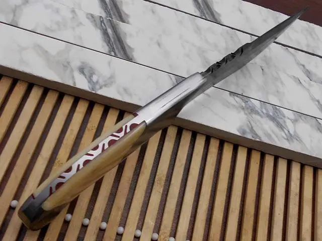 Alt view image 3 of 5 - 10.5 Long hand forged Damascus steel skinning Knife,5.5" full tang blade, Natural Camel bone scale with Damascus bolster & Pommel, Cow hide Leather sheath included