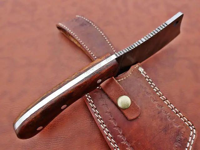 Alt view image 5 of 7 - 9" long hand forged Twist Pattern Damascus steel Butcher Meat cleaver, Natural walnut wood scale, Cow hide Leather sheath included Brown