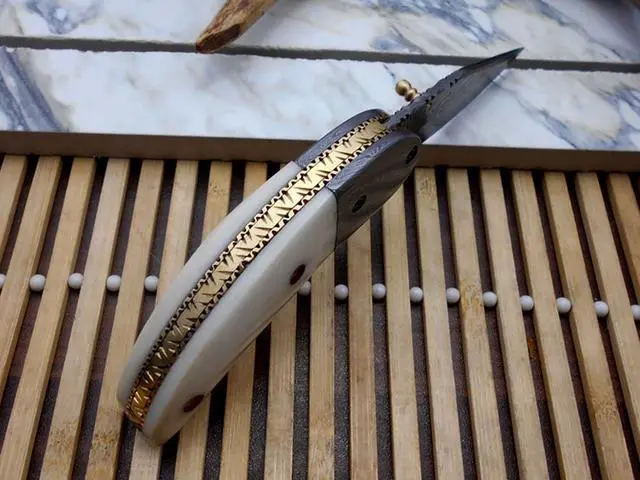 Alt view image 2 of 5 - 7"long Damascus steel Folding Knife with camel bone scale custom made 3" Hand Forged blade cow hide leather sheath