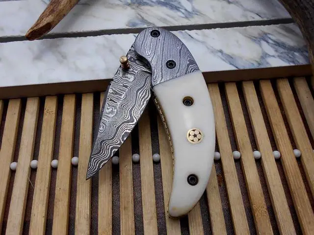 Alt view image 3 of 5 - 7"long Damascus steel Folding Knife with camel bone scale custom made 3" Hand Forged blade cow hide leather sheath