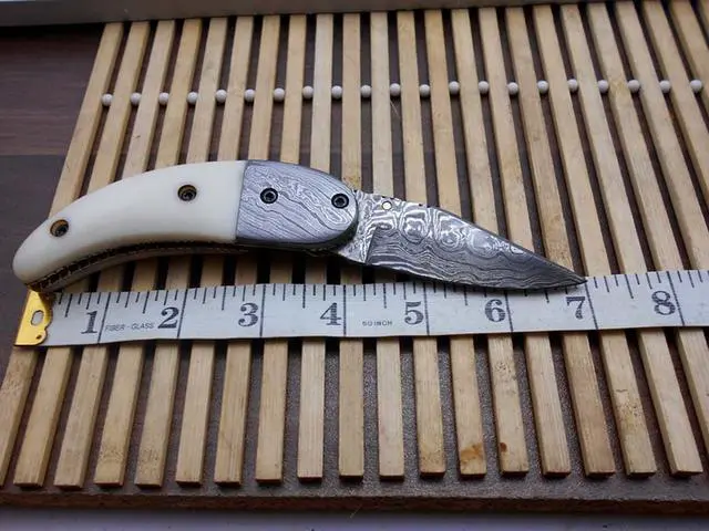 Alt view image 4 of 5 - 7"long Damascus steel Folding Knife with camel bone scale custom made 3" Hand Forged blade cow hide leather sheath