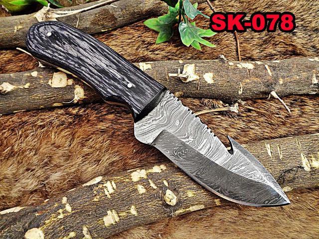gut hook skinning knife with leather sheath