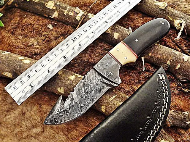 Main image of 8"Long gut hook skinning Knife, hand forged Damascus steel, full tang blade, Bull horn camel bone & Damascus bolster, cow leather sheath