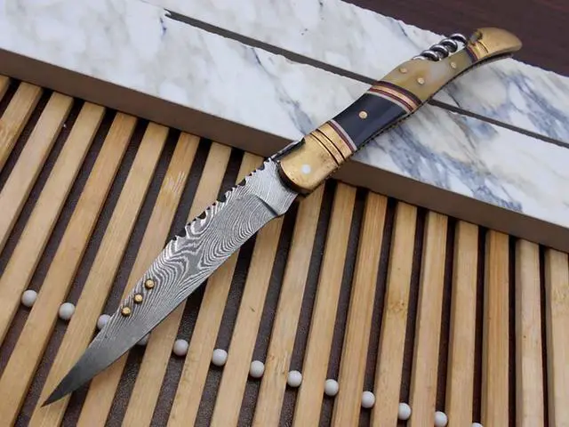 Main image of 8 Inches long Damascus steel Hand Forged Lagouile Folding Knife W/wine opener, Corkscrew, Bull horn camel bone & brass scale, Cow leather sheath with Belt loop