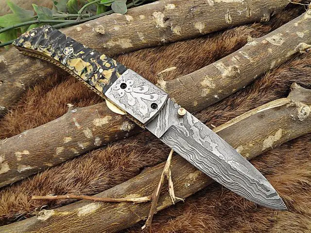 Main image of Damascus Steel Folding knife, Exotic Jigged scale in Camouflage color, Thumb knob & liner lock, Cow Leather sheath (Camouflage)