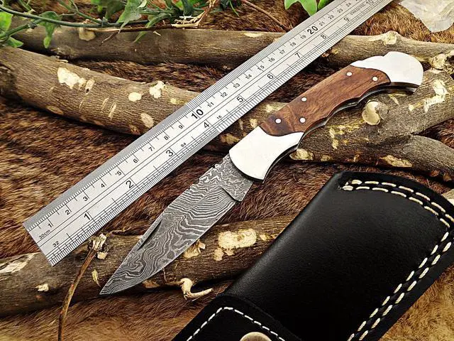 Main image of Damascus steel 7.5" long Folding Knife, Walnut wood with Steel bolster scale, custom made 3.5" Hand Forged blade cow hide leather sheath