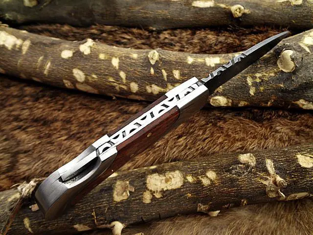 Alt view image 5 of 6 - Damascus steel 7.5" long Folding Knife, Walnut wood with Steel bolster scale, custom made 3.5" Hand Forged blade cow hide leather sheath