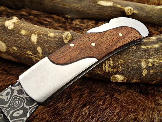 Alt view image 3 of 6 - Damascus steel 7.5" long Folding Knife, Walnut wood with Steel bolster scale, custom made 3.5" Hand Forged blade cow hide leather sheath