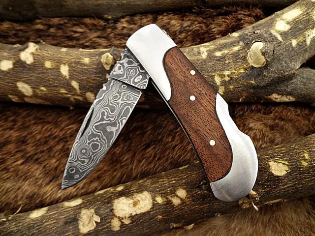 Alt view image 4 of 6 - Damascus steel 7.5" long Folding Knife, Walnut wood with Steel bolster scale, custom made 3.5" Hand Forged blade cow hide leather sheath