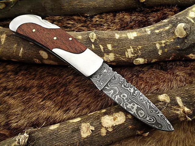 Alt view image 6 of 6 - Damascus steel 7.5" long Folding Knife, Walnut wood with Steel bolster scale, custom made 3.5" Hand Forged blade cow hide leather sheath