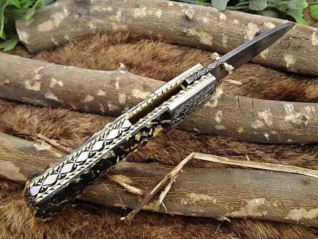 Alt view image 2 of 7 - Damascus Steel Folding knife, Exotic Jigged scale in Camouflage color, Thumb knob & liner lock, Cow Leather sheath (Camouflage)
