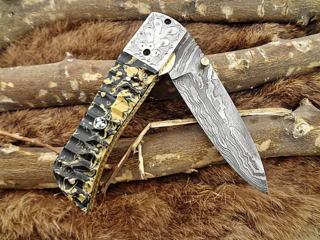 Alt view image 5 of 7 - Damascus Steel Folding knife, Exotic Jigged scale in Camouflage color, Thumb knob & liner lock, Cow Leather sheath (Camouflage)