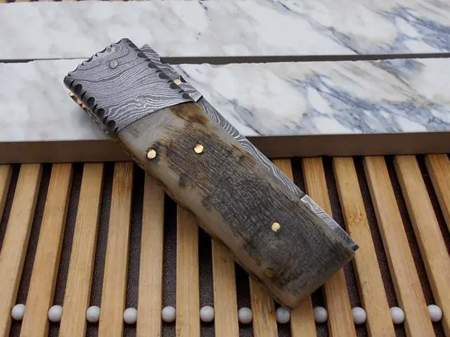 Alt view image 5 of 6 - Damascus steel 7.5" long Folding Knife Ram horn with Damascus bolster scale, custom made 3" Hand Forged blade cow hide leather sheath